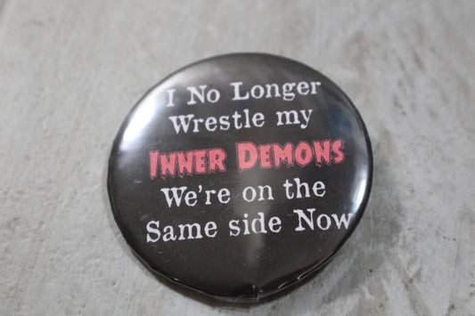 I no longer wrestle my inner demons metal button 2.25in