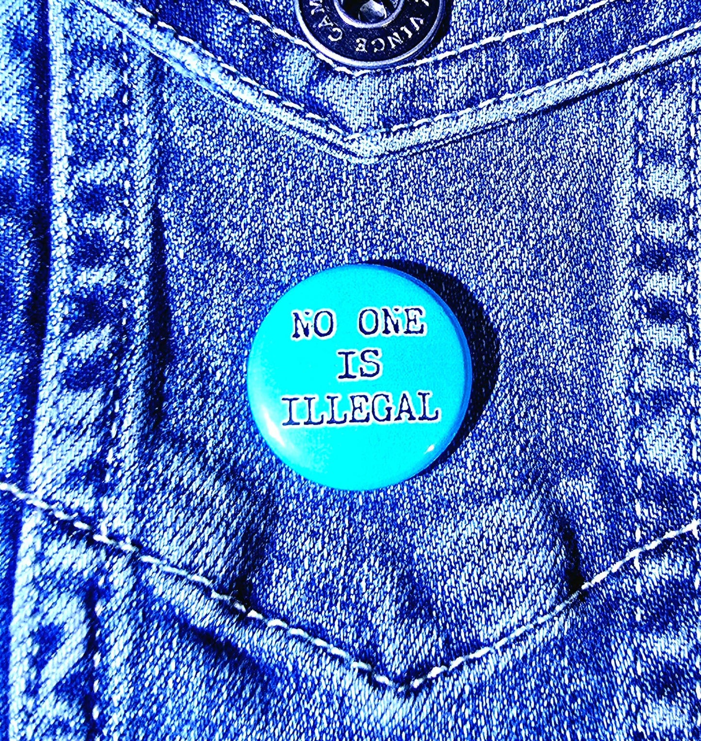 Femmearchist - No Human Is Illegal One Inch Button
