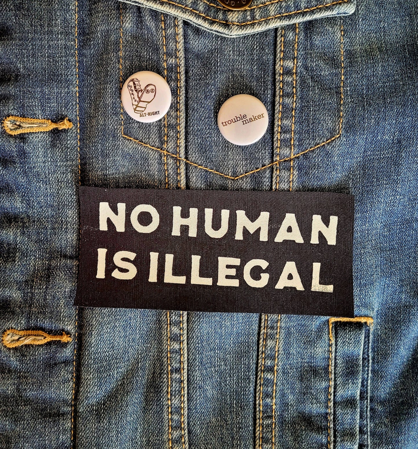 Femmearchist - No Human is Illegal Sew On Patch